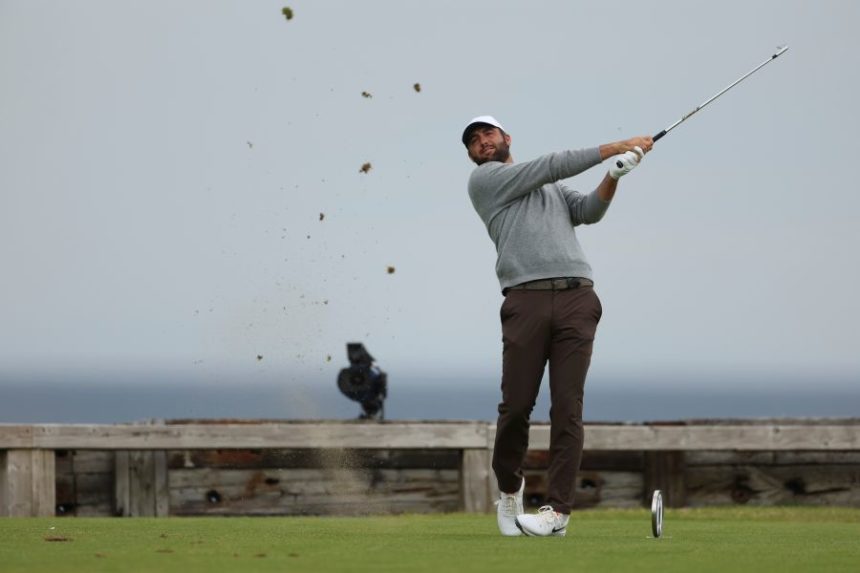Scottie Scheffler of the United States plays his tee shot on the 6th tee during the first round of the British Open golf championship at the Royal Portrush Golf Club, Northern Ireland, Thursday, July 17, 2025. (AP Photo/Peter Morrison)