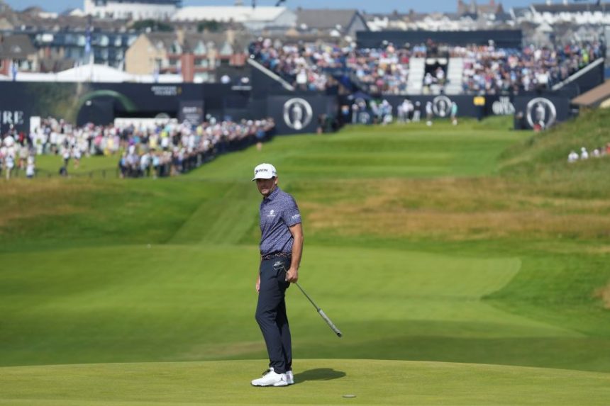 Keegan Bradley of the United States walks on the 1st green during a practice round for the British Open golf championship at the Royal Portrush Golf Club, Northern Ireland, Wednesday, July 16, 2025. (AP Photo/Jon Super)