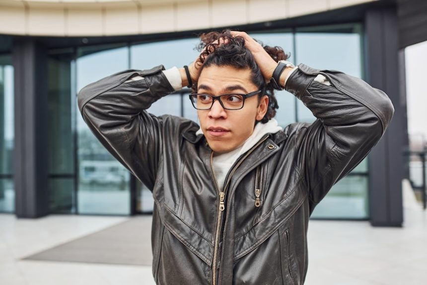 handsome young man with curly black hair standing 2025 03 18 22 01 56 utc