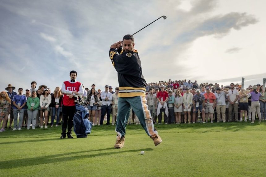 This image released by Netflix shows Benito Antonio Martínez Ocasio, left, and Adam Sandler in a scene from "Happy Gilmore 2." (Scott Yamano/Netflix via AP)