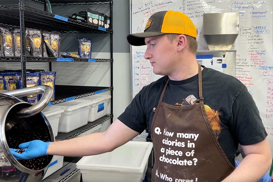 Thor's Chocolate employee making a chocolate-covered treat. | Rett Nelson, EastIdahoNews.com