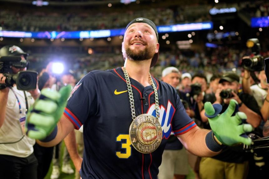 Seattle Mariners' Cal Raleigh celebrates after winning the MLB baseball All-Star Home Run Derby, Monday, July 14, 2025, in Atlanta. (AP Photo/Mike Stewart)