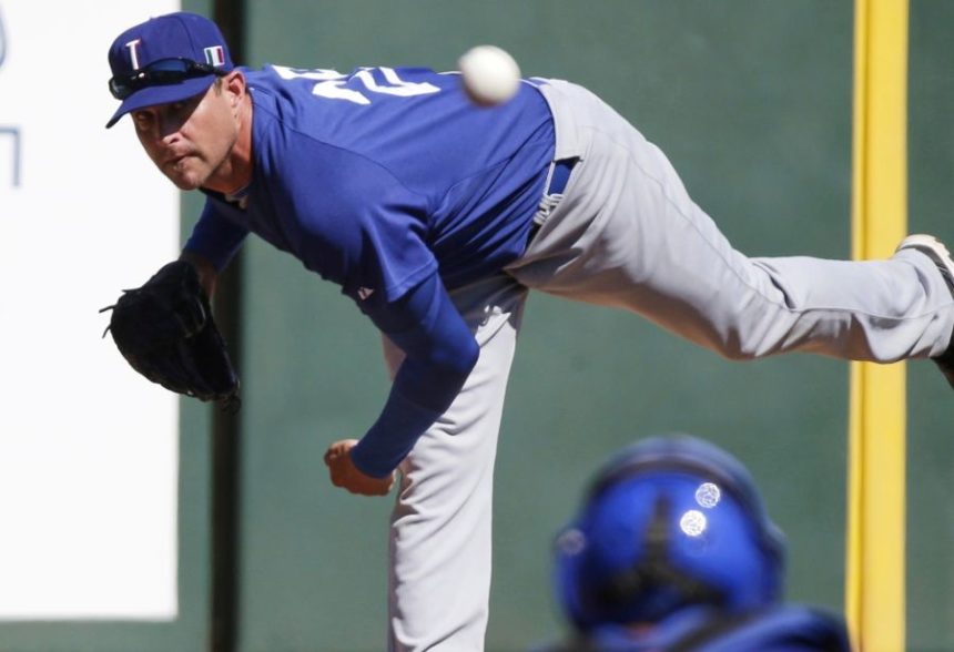 FILE - Italy's Dan Serafini throws before the first inning of an exhibition spring training baseball game against the Los Angeles Angels Wednesday, March 6, 2013, in Tempe, Ariz. (AP Photo/Morry Gash, File)