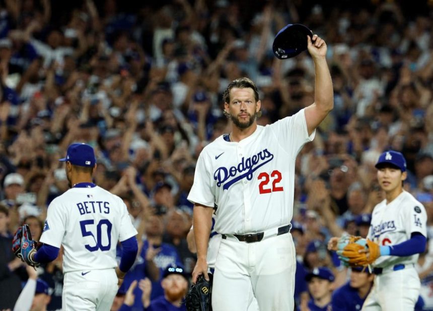 Los Angeles Dodgers pitcher Clayton Kershaw (22) tips his cap after recording his 3,000th career strike out by striking out Chicago White Sox's Vinny Capra during the sixth inning of a baseball game Wednesday, July 2, 2025, in Los Angeles. (AP Photo/Kevork Djansezian)