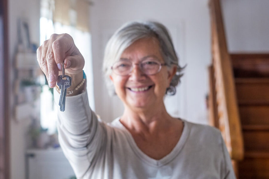 senior woman holding house keys