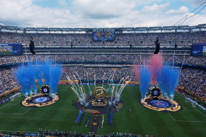 Players stand line before starting the Club World Cup final soccer match between Chelsea and PSG in East Rutherford, N.J., Sunday, July 13, 2025. (AP Photo/Pamela Smith)