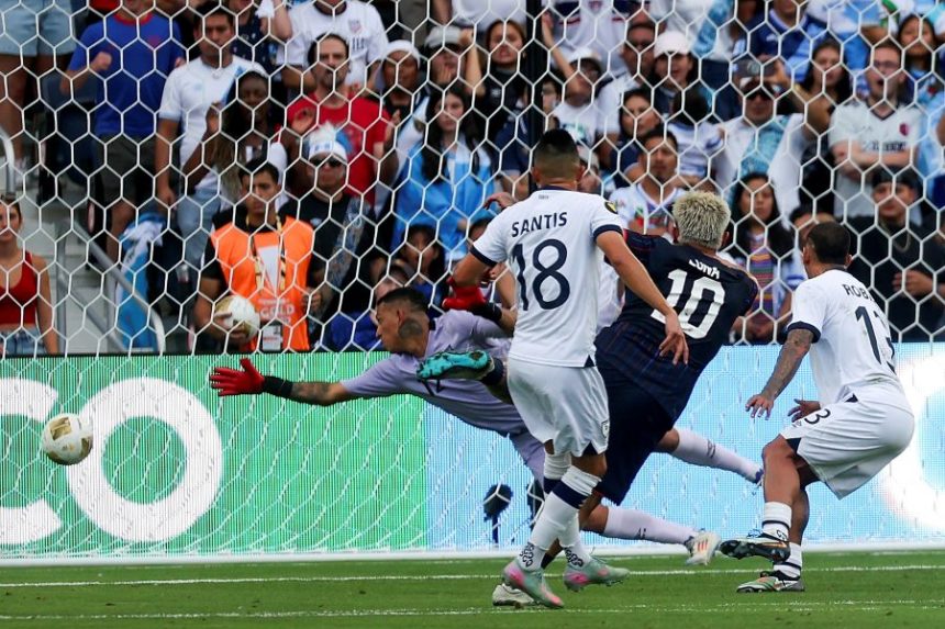 United States midfielder Diego Luna (10) scores a goal past Guatemala goalkeeper Kenderson Navarrol, left, during the first half of a CONCACAF Gold Cup semifinal soccer match, Wednesday, July 2, 2025, in St. Louis. (AP Photo/Scott Kane)