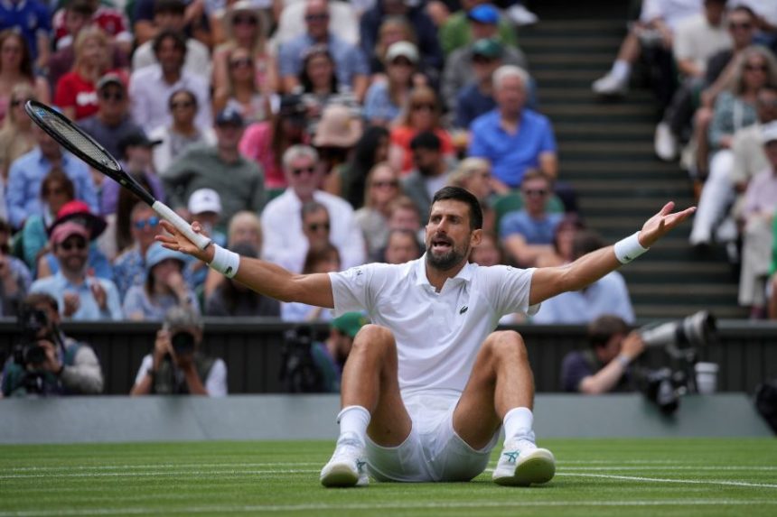 Serbia's Novak Djokovic reacts as he plays against Australia's Alex de Minaur during a fourth round men's singles match at the Wimbledon Tennis Championships in London, Monday, July 7, 2025. (AP Photo/Kin Cheung)