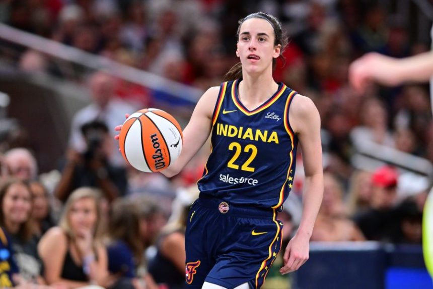 Indiana Fever's Caitlin Clark dribbles during the second half of a WNBA basketball game against the Dallas Wings, Sunday, July 13, 2025, in Indianapolis. (AP Photo/Doug McSchooler)