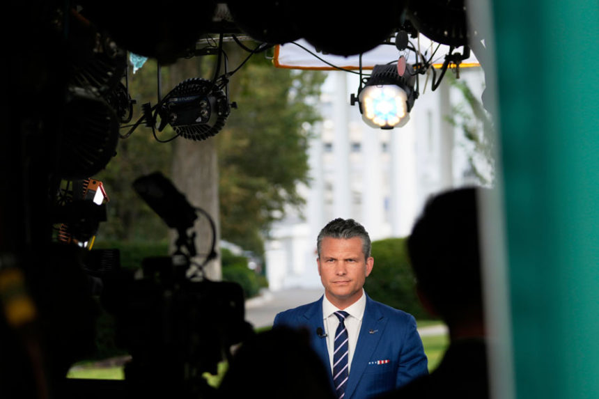 Defense Secretary Pete Hegseth prepares to give a television interview outside the White House Thursday, Aug. 7, 2025, in Washington. | Mark Schiefelbein, Associated Press