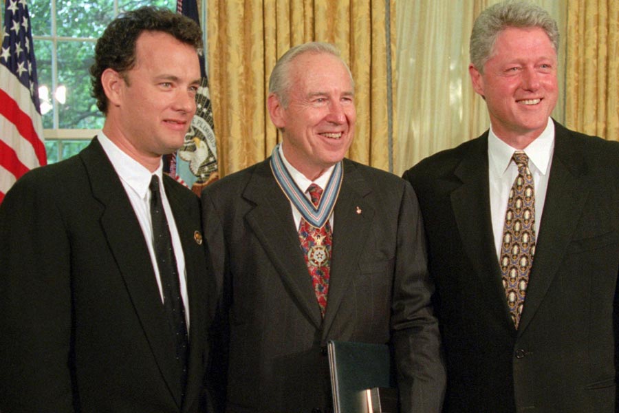 President Clinton stands with actor Tom Hanks, left, and former astronaut James Lovell in the Oval Office of the White House Wednesday, July 26, 1995, after presenting Lovell with the Congressional Space Medal of Honor. Hanks portrayed Lovell in the movie "Apollo 13." | Wilfredo Lee, Associated Press