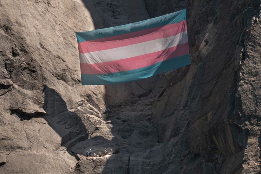 A group of people, including Shannon Joslin, a Yosemite National Park ranger and biologist who was fired, hang a transgender flag on El Capitan in Yosemite National Park, Calif., May 20, 2025. | Mitchell Overton, Associated Press