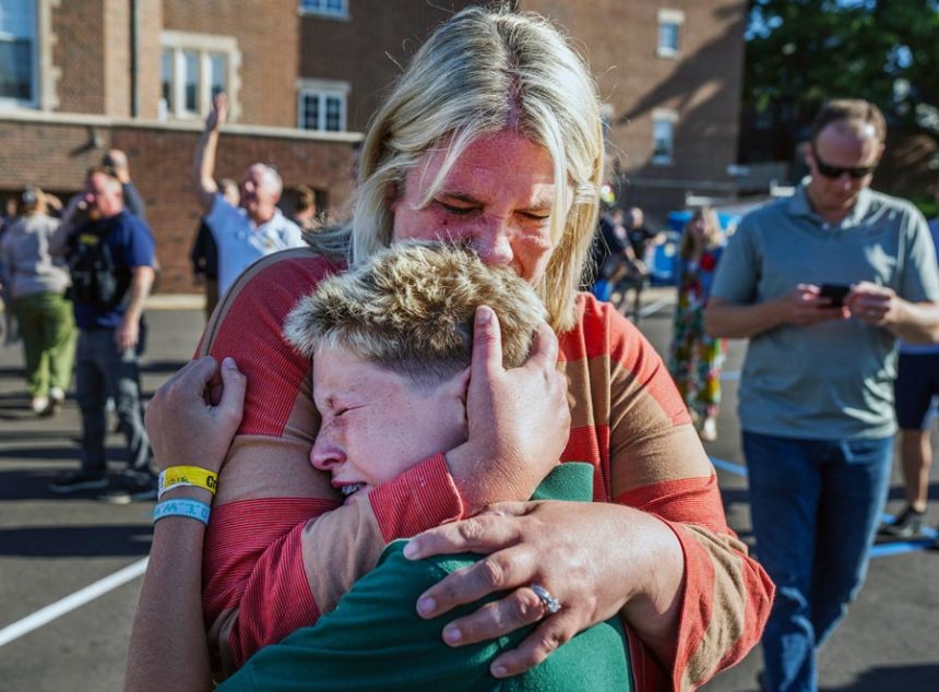 A parent hugs her son during an active shooter situation at the Annunciation Church in Minneapolis, Minn., Wednesday, Aug. 27, 2025. | Richard Tsong-Taatarii, Star Tribune via Associated Press