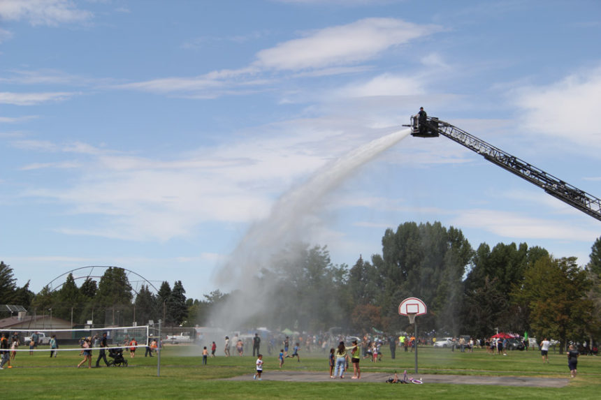 The Chubbuck Fire Department sprays water down on festivalgoers.