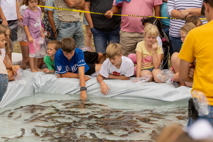Dozens of children waiting at the edge of the Fish Pond prior to the event starting. | Daniel V. Ramirez, EastIdahoNews.com