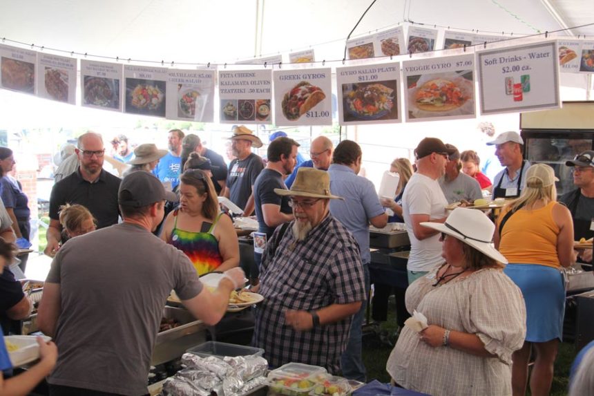 People move through the festival's two food lines.