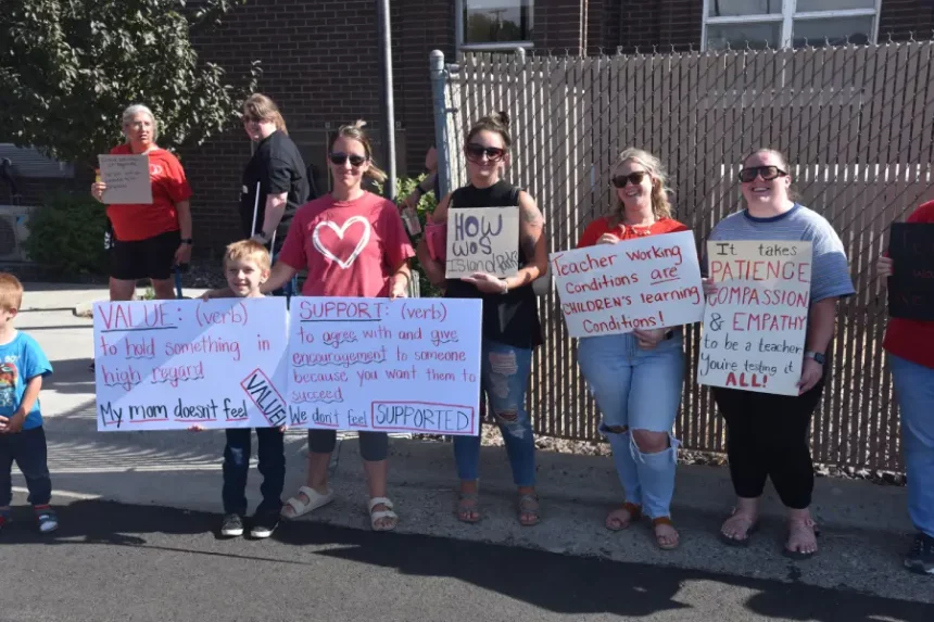 Sign Holders at D91 Teacher's Protest