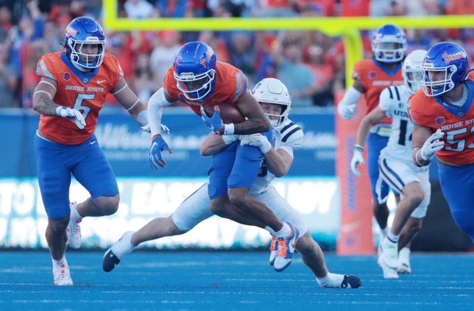 Boise State safety Ty Benefield gets taken down by Utah State tight end Will Monney after picking up a fumble. Kyle Green For the Idaho Statesman