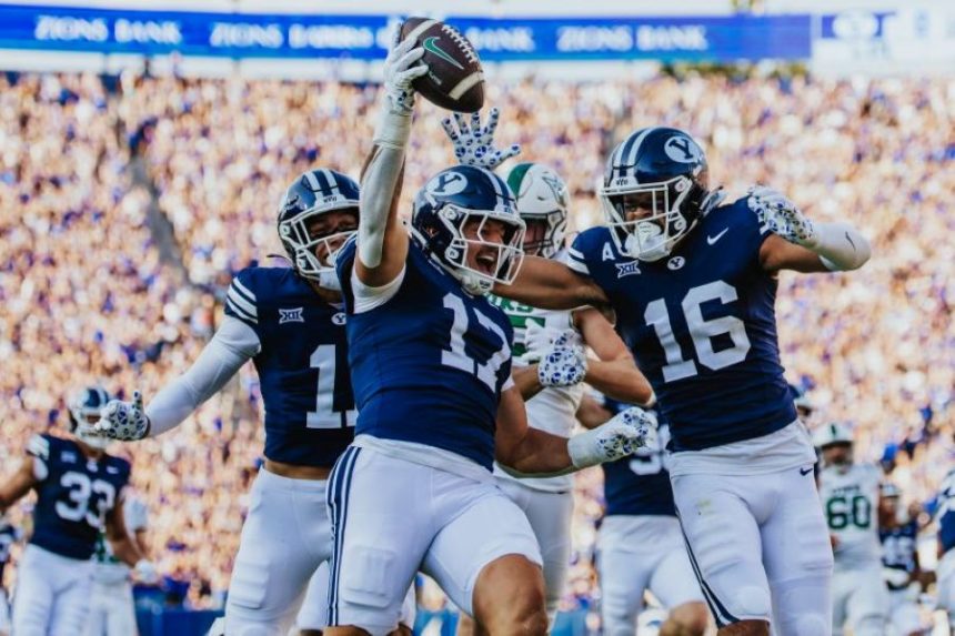 BYU’s Jack Kelly celebrates a 62-yard scoop-and-score touchdown during Saturday’s game. | Tyler Staten for KSL.com.