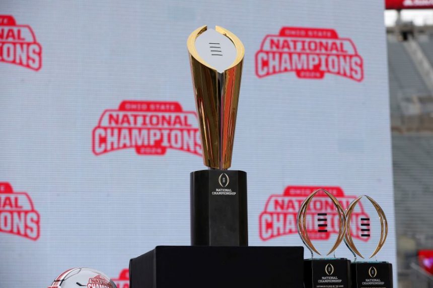 FILE - The College Football Playoff National Championship Trophy on display before the Ohio State Buckeyes National Championship celebration at Ohio Stadium in Columbus, Ohio, Jan. 26, 2025. (AP Photo/Joe Maiorana, File)