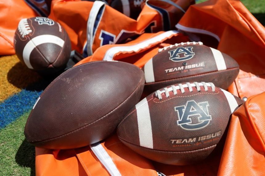 FILE - Auburn footballs sit in a bag prior to an NCAA football game against Georgia, Sept. 30, 2023, in Auburn, Ala. (AP Photo/Stew Milne, File)