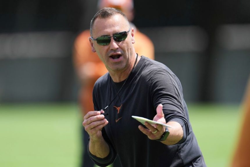 Texas head coach Steve Sarkisian gives instruction during the team's NCAA college football practice in Austin, Texas, Wednesday, July 30, 2025. (AP Photo/Eric Gay)