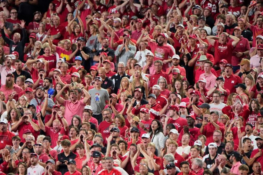 Fans cheer during the second half of an NCAA college football game between Cincinnati and Nebraska Thursday, Aug. 28, 2025, at Arrowhead Stadium in Kansas City, Mo. (AP Photo/Charlie Riedel)