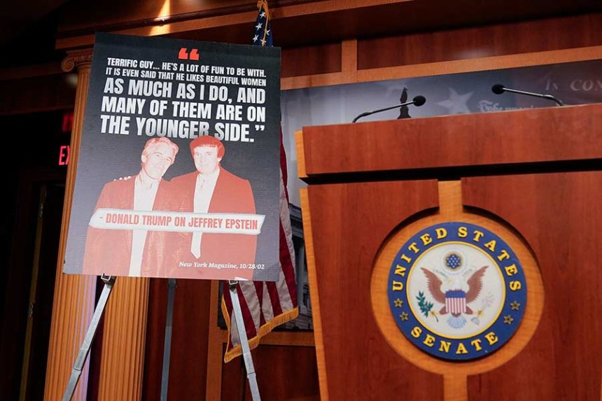 A sign showing a photo of President Donald Trump and Jeffrey Epstein is displayed ahead of a Senate Democrat news conference on Wednesday. Mandatory Credit: Oliver Contreras/AFP/Getty Images via CNN Newsource