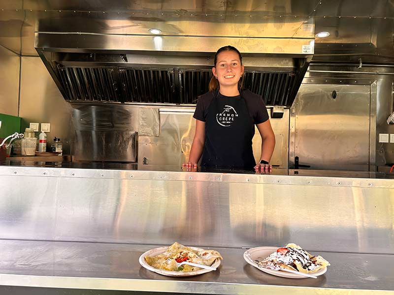 Isabella Mayberry poses for a photo inside her food trailer. | Rett Nelson, EastIdahoNews.com
