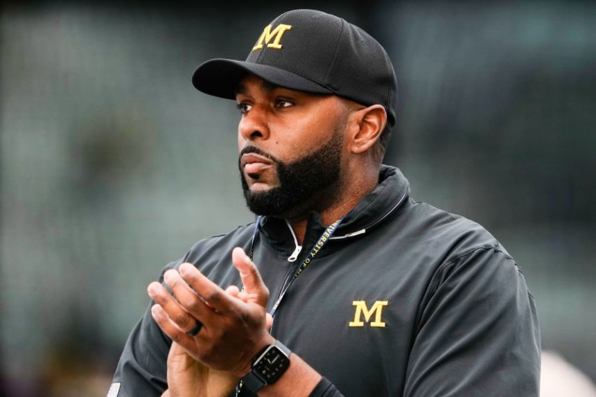 FILE - Michigan head coach Sherrone Moore walks on the field before an NCAA college football game against Washington, Saturday, Oct. 5, 2024, in Seattle. (AP Photo/Lindsey Wasson)