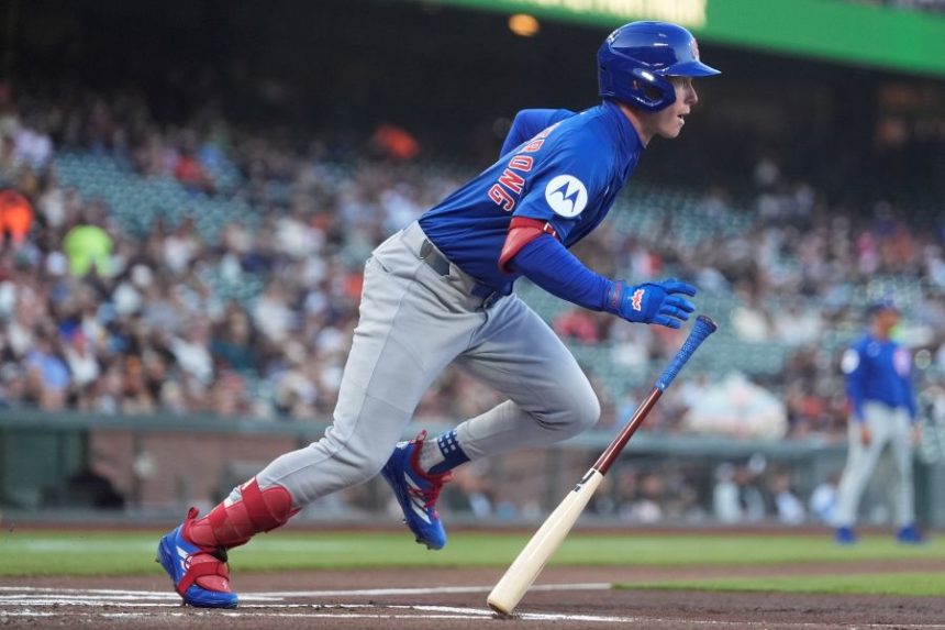 Chicago Cubs' Pete Crow-Armstrong runs to first base after hitting a single against the San Francisco Giants during the first inning of a baseball game in San Francisco, Tuesday, Aug. 26, 2025. (AP Photo/Jeff Chiu)