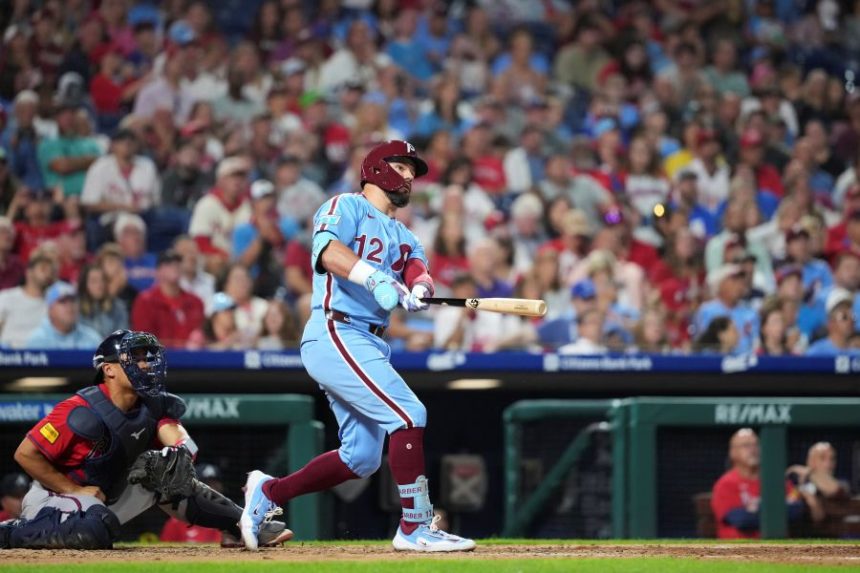 Philadelphia Phillies' Kyle Schwarber watches after hitting a two-run home run against Atlanta Braves pitcher Austin Cox during the fourth inning of a baseball game Thursday, Aug. 28, 2025, in Philadelphia. (AP Photo/Matt Slocum)