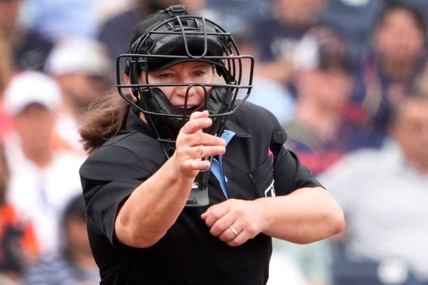 FILE - Home plate umpire Jen Pawol calls a strike during the third inning of a spring training baseball game between the Miami Marlins and Houston Astros, Sunday, March 10, 2024, in West Palm Beach, Fla. (AP Photo/Jeff Roberson, File)