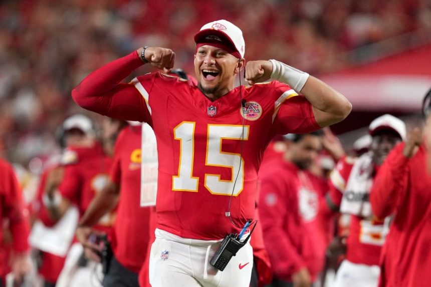 Kansas City Chiefs quarterback Patrick Mahomes cheers from the sidelines during the second half of a preseason NFL football game against the Chicago Bears Friday, Aug. 22, 2025, in Kansas City, Mo. (AP Photo/Ed Zurga)