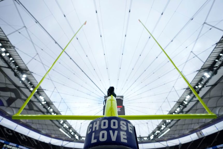 FILE - A view of Choose Love signage on the goal post before an NFL football game between the New England Patriots and the Indianapolis Colts at Deutsche Bank Park Stadium in Frankfurt, Germany, Nov. 12, 2023. (AP Photo/Steve Luciano, File)