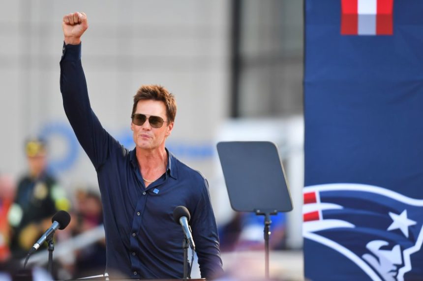 Former New England Patriots quarterback Tom Brady speaks after a bronze statue of himself was unveiled in Patriot Place Plaza before an NFL preseason football game between the Washington Commanders and the New England Patriots Friday, Aug. 8, 2025, in Foxborough, Mass. (AP Photo/Charles Krupa)
