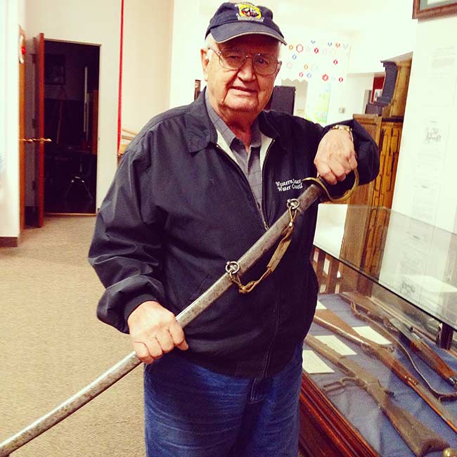 Ray Rigby with a sword he inherited from Brigham Young. | Courtesy Jerry Rigby