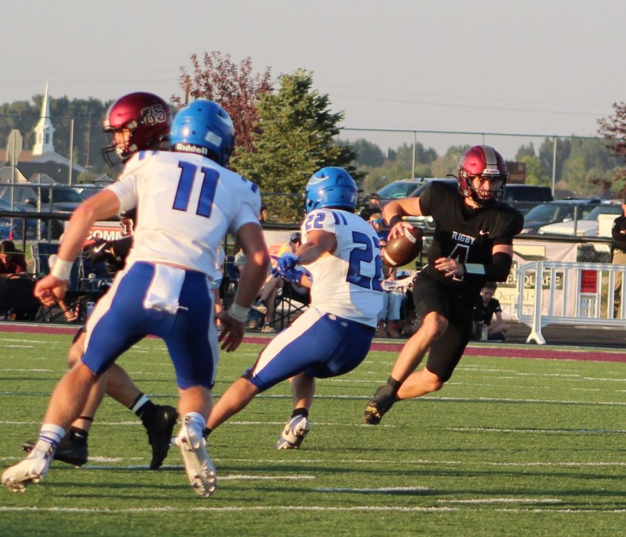 Rigby quarterback Jacob Flowers looks for running room agains the Coeur d'Alene defense. | Allan Steele, EastIdahoSports.com