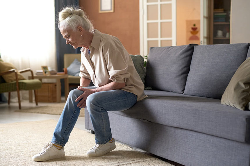 senior woman suffering from her sore knee