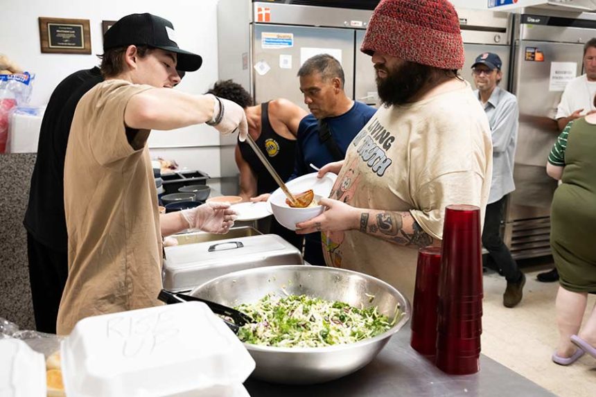Volunteer, left, serving food at the Idaho Falls Rescue Mission | Courtesy Michelle Claxton