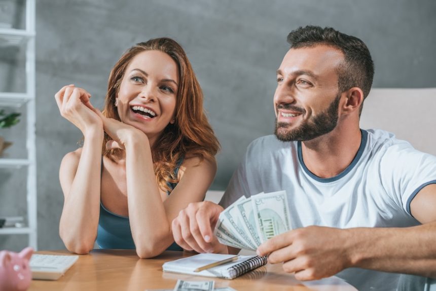 smiling couple planning family budget and looking 2024 11 18 06 14 26 utc