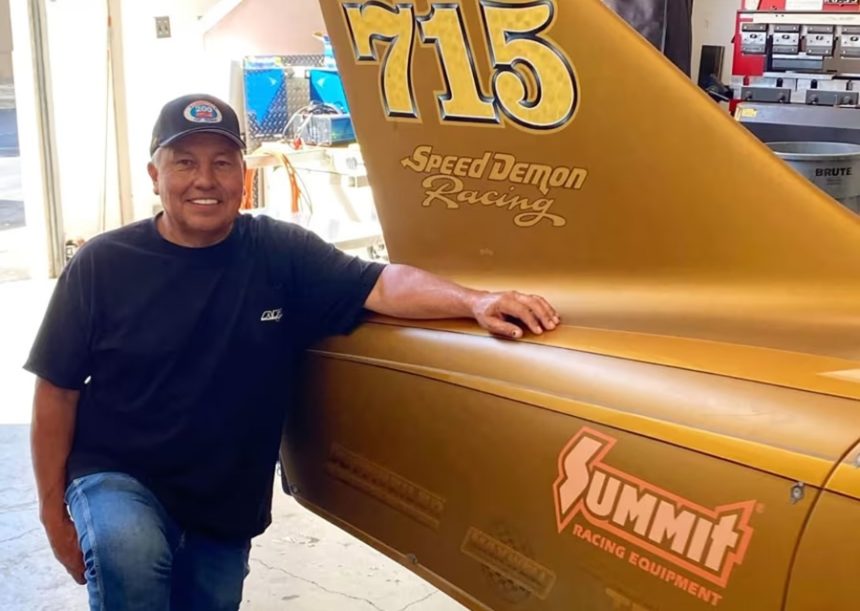 Chris Raschke poses alongside the second iteration of Speed Demon's streamliner.