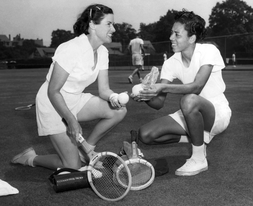 FILE - Sarah Palfrey Cook, left, chats with Althea Gibson, National Negro Women's Tennis Champion from Sumter, S.C., at the west side tennis club at Forest Hills, New York on July 29,1950. (AP Photo,File)