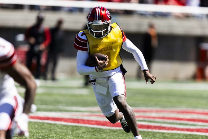 White team quarterback Devon Dampier (4) runs the ball down the field during the Utah Utes’ 22 Forever spring game at Rice-Eccles Stadium in Salt Lake City on Saturday, April 19, 2025. (Photo: Brice Tucker, Deseret News)