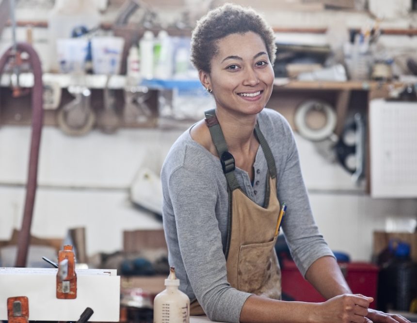 view of a smiling black woman factory worker at he 2025 04 03 04 20 24 utc
