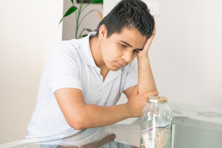 young guy crestfallen looking at his savings in a 2025 03 05 09 29 08 utc