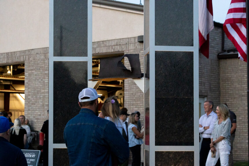 A father and daugher looking at the new 9/11 monument in front of the Bonneville County Fire District 1 building. | Daniel V. Ramirez, EastIdahoNews.com