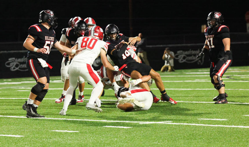 Hillcrest quarterback Tyson Sweetwood tackled after running for a gain against the Madison Bobcats Friday night. | Photo courtesy Amy Ward