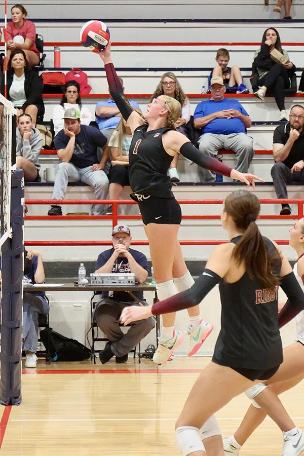 Rigby volleyball Brookie Hoge (1) spikes the ball against Pocatello