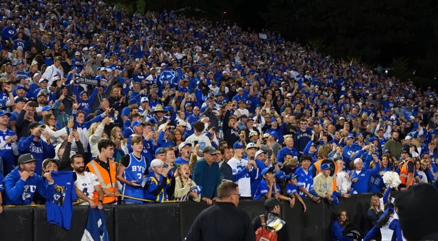 Brigham Young fans cheer after an NCAA college football game against Colorado Saturday, Sept. 27, 2025, in Boulder, Colo. (AP Photo/David Zalubowski)